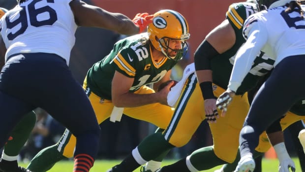 Green Bay Packers quarterback Aaron Rodgers (12) plunges ahead to convert on fourth down during the second quarter of their game Sunday, Oct. 17, 2021, at Solider Field in Chicago. The Green Bay Packers beat the Chicago Bears, 24-14.

Packers18 10